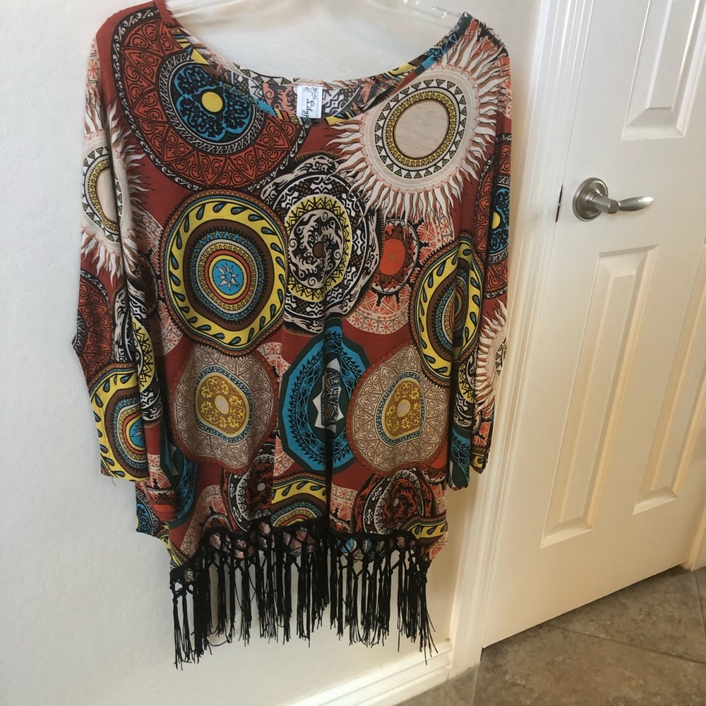 Poncho style blouse with fringe bottom